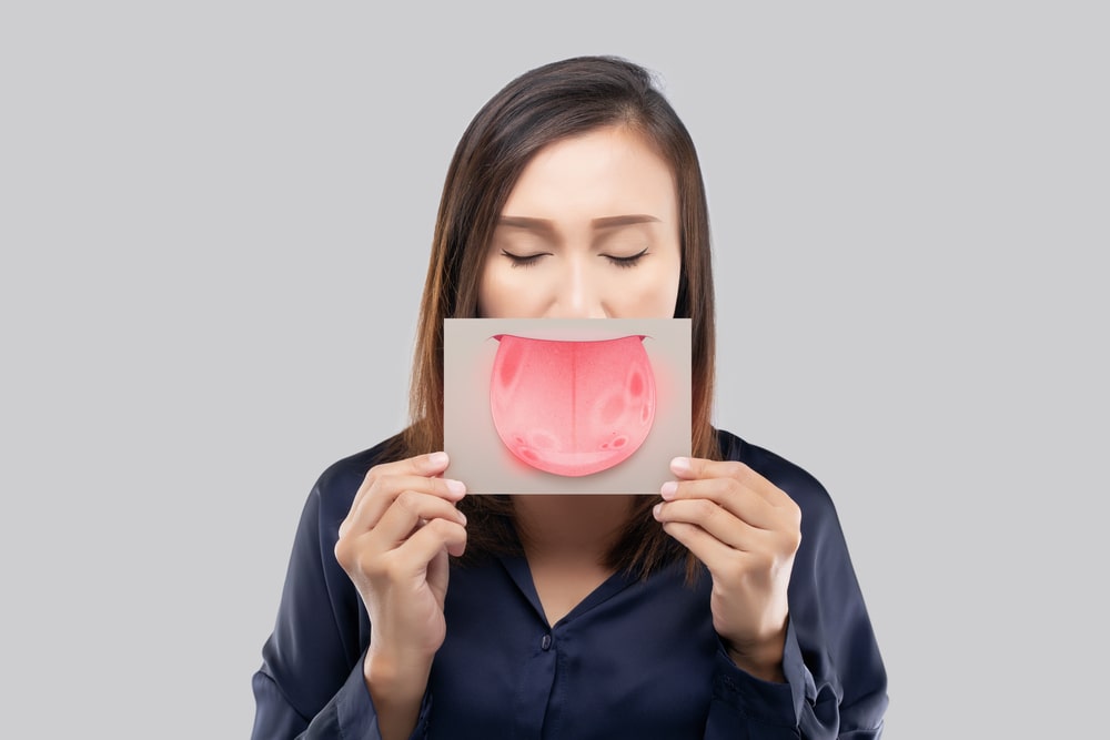 Le cancer de la bouche peut se manifester par des taches sur la langue